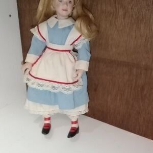 Elegant Blue and White Doll with Red Trim